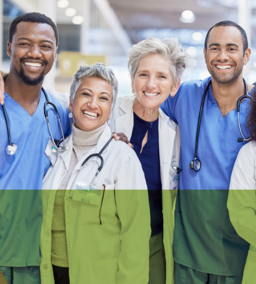 Happy diverse healthcare team huddled together stands and smiles at camera